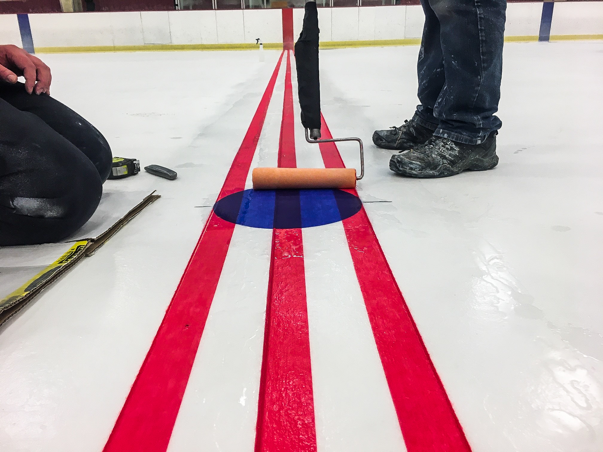 While campus was closed to visitors because of COVID-19, staff conducted facility updates such as repainting the Super Rink ice sheets.